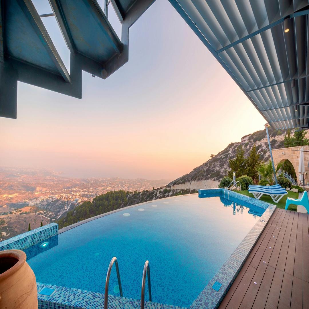 Sleek penthouse interior with panoramic floor-to-ceiling windows, Malta